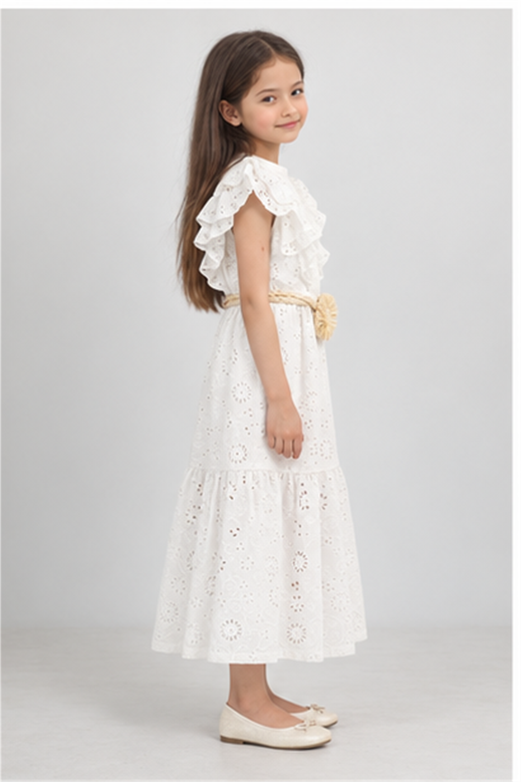 Girls' long white eyelet dress with rosette belt on child model, right side view