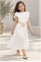 Girls' long white eyelet dress with rosette belt on child model, lifestyle view