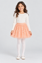 Girls’ blush-pink embroidered tulle skirt, full front on child model Lina