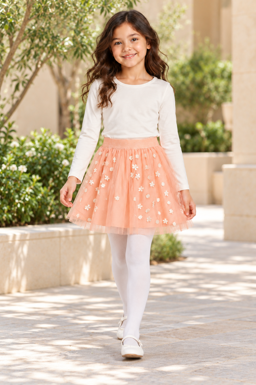 Girls’ blush-pink embroidered tulle skirt, Riyadh courtyard lifestyle on Lina