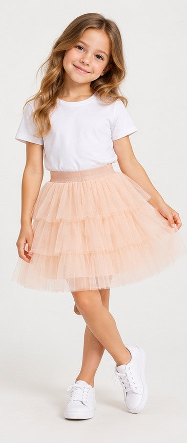 Lifestyle view of Gingersnaps girls peach tiered tulle skirt