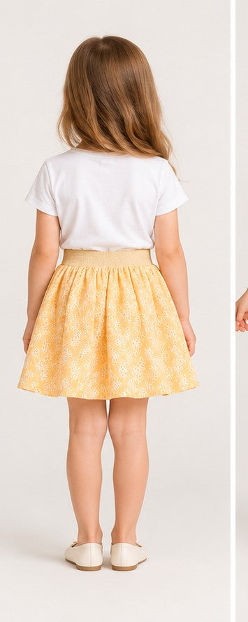 Girls model back view wearing Gingersnaps yellow embroidered skirt