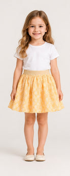 Girls model front view wearing Gingersnaps yellow embroidered skirt