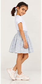 Girls model right view wearing Gingersnaps pale blue floral skirt