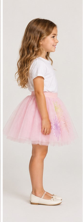 Girls model left view wearing Gingersnaps pale pink tulle skirt with embroidered motifs