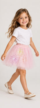 Girls model lifestyle view wearing Gingersnaps pale pink tulle skirt with embroidered motifs