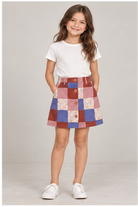 Girls' patchwork plaid skirt on child model, front view