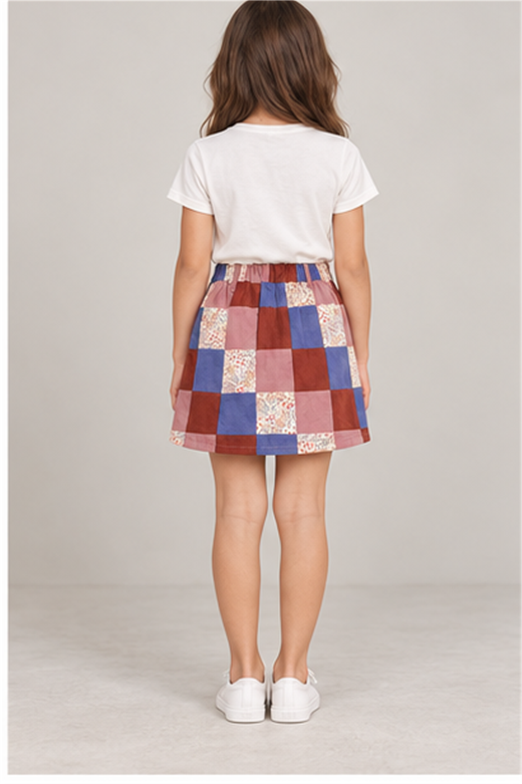 Girls' patchwork plaid skirt on child model, back view