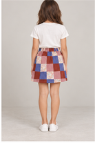 Girls' patchwork plaid skirt on child model, back view