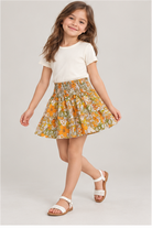 Girls' floral skirt on child model, lifestyle view
