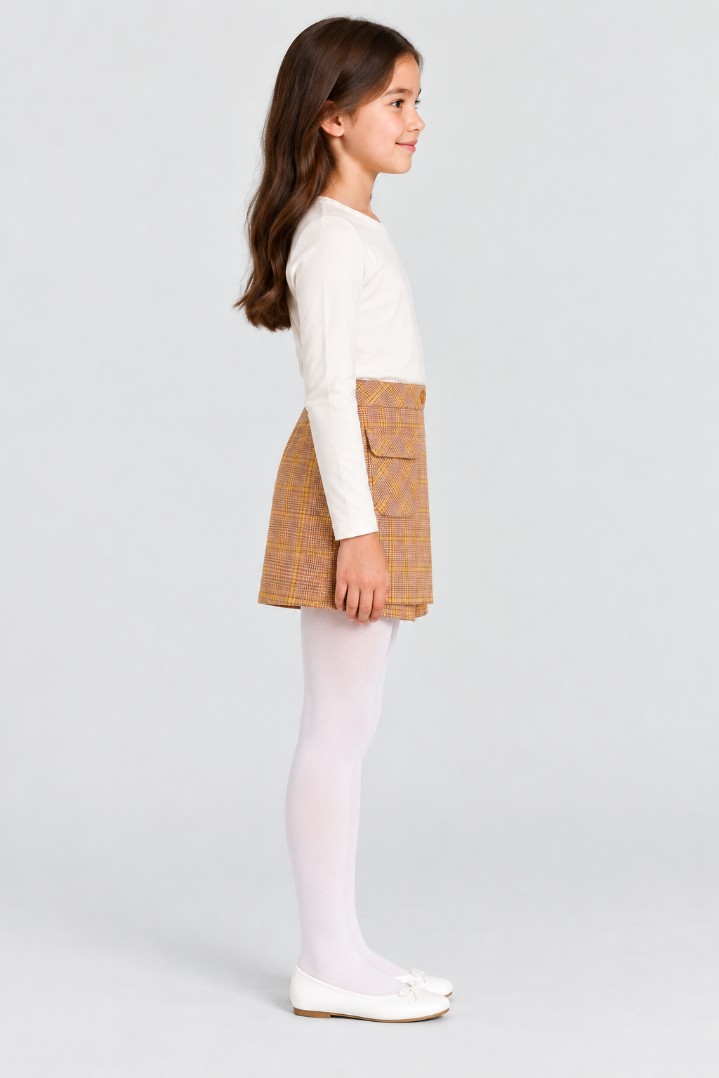 Girls plaid skort on child model, side view