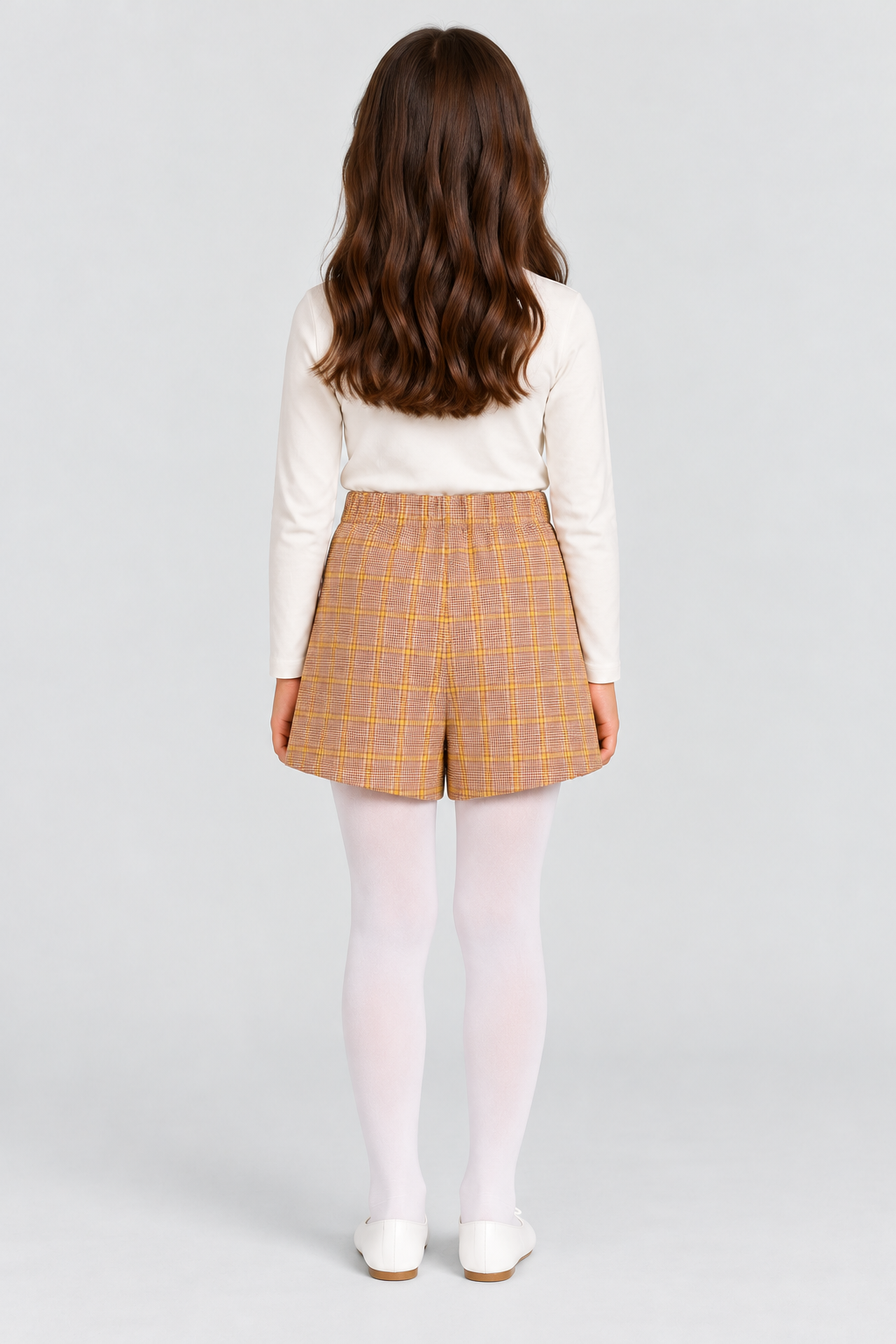 Girls plaid skort on child model, back view
