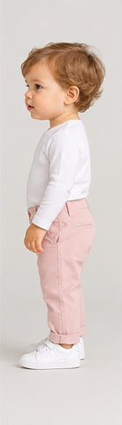 Right side view of boys' pale pink infant chinos with folded cuffs on an infant boy