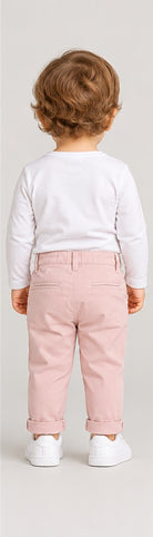 Back view of boys' pale pink infant chinos with folded cuffs on an infant boy