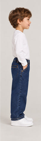 Right side view of boys' dark indigo denim jeans on a young boy