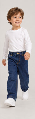 Lifestyle view of boys' dark indigo denim jeans on a young boy
