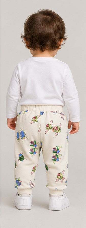 Back view of boys' ivory insect print baby joggers on an infant boy