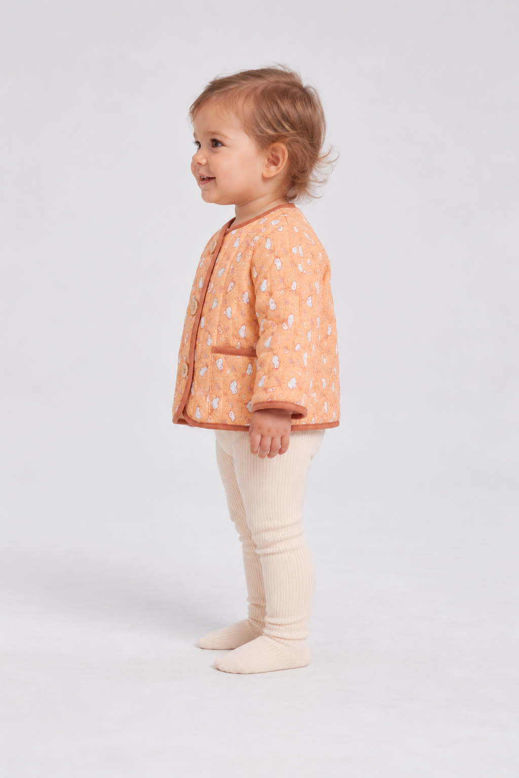 Left side baby model view of Gingersnaps printed infant jacket