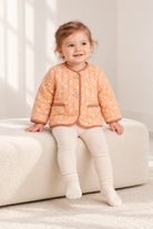 Lifestyle baby model view of Gingersnaps printed infant jacket