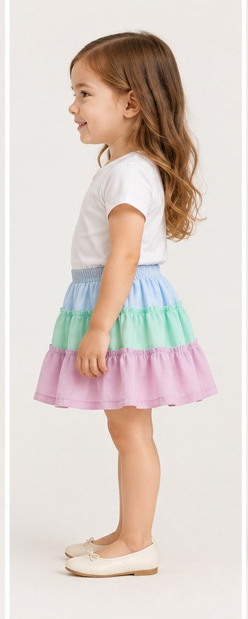 Girls toddler model right view wearing Gingersnaps pastel tiered skirt