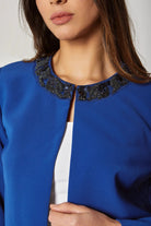 داليدرس جاكيت قصير سادة مزين بالستراس من أعلى نسائي أزرق