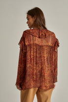 داليدرس بلوزة نسائية منقوشة بنقشة ثعبان برتقالي قاتم