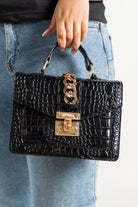 داليدرس حقيبة يد سادة مزينة بحلقات معدنية