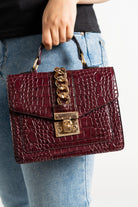 داليدرس حقيبة يد سادة مزينة بحلقات معدنية