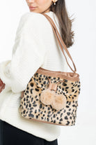 داليدرس حقيبة يد فرو مزينة برباط فرو