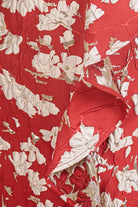 دريسنج بولا فستان ميدي موردة بكشكشة جانبية بلا أكمام أحمر