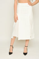 نتشي تنورة ميدي سادة ناعمة بكسرات صغيرة على الفخذين