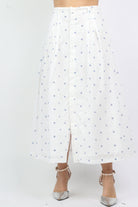 داليدرس تنورة ميدي منقطة مفتوحة من الأمام أبيض