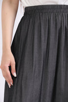 ميكا تنورة ميدي بخصر مطاطي بكسرات أسود