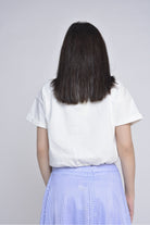 ميكا قميص نص بطن بجيوب وأزرار أمامية كم قصير نسائي