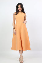 ميكا فستان ميدي سادة واسع بجيوب بدون كم