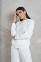 نتشي بلوزة بتطريز بأزراز برقبة دائرية وكم طويل نسائي