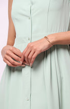 نتشي فستان ميدي بدون أكمام سادة بأزرار أمامية