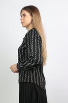 نتشي بلوزة منقوشة كم طويل