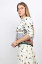 نتشي بلوزة مشجرة فتحة عنق دائرية 3/4 كم نسائي أوف وايت