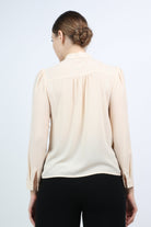 نتشي بلوزة بفيونكة سادة مع كم طويل نسائي