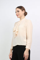 نتشي بلوزة بفيونكة سادة مع كم طويل نسائي